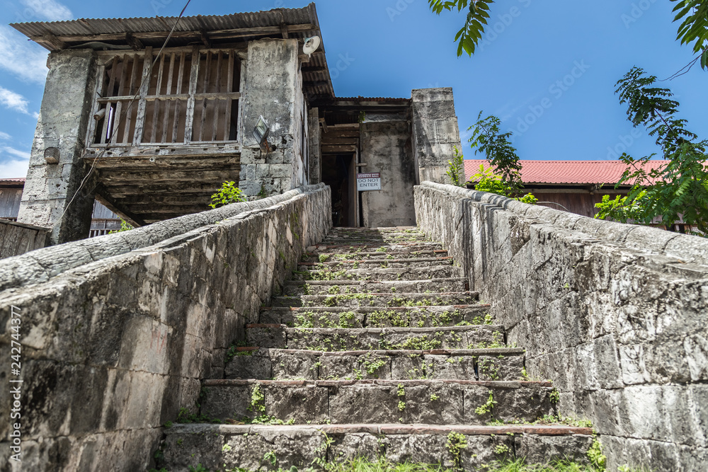 old stone staircase in Baclayon catolic Church in Bohol Island, Philippines.