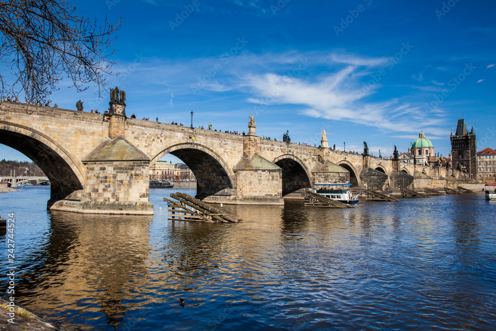 PRAGUE, CZECH REPUBLIC - APRIL, 2018: The medieval Charles Bridge over the Vltava river in Prague city