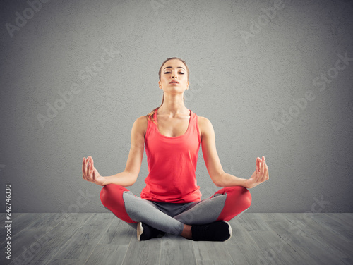Young girl relaxing in yoga position