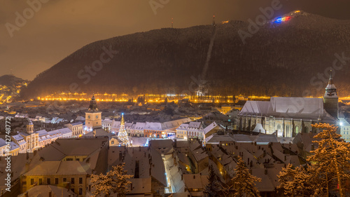 Council Square Brasov, Transylvania landmark, Romania. View from above at night, Black Church and christmas tree are in the sceene. Brasov, probably the best town in the world. photo
