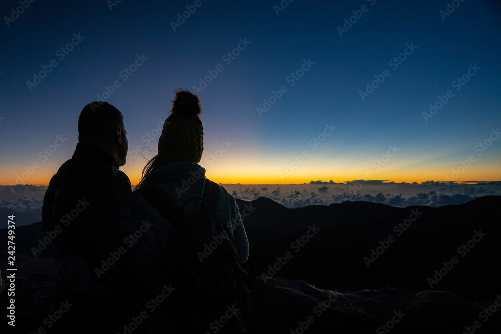 silhouette of couple at sunrise