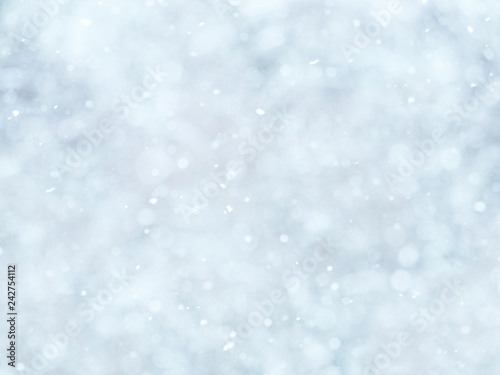 Snowing. Abstract soft natural winter background, focus on falling snowflakes © ANGHI