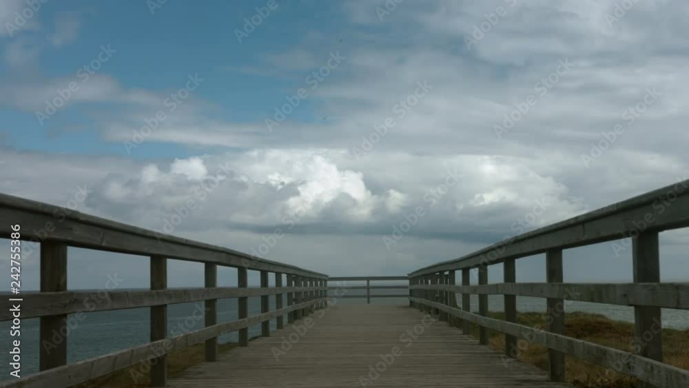 Horizon sky and sea over an empty wooden pier on the cliff Horizon sky and sea over an empty wooden pier on the cliff