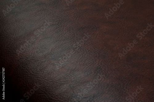Red, brown leather, skin texture. Background rough, abstract. 