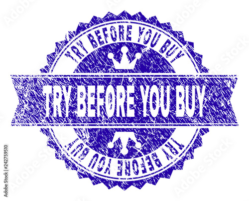 TRY BEFORE YOU BUY rosette seal watermark with distress style. Designed with round rosette, ribbon and small crowns. Blue vector rubber watermark of TRY BEFORE YOU BUY tag with grunge style.