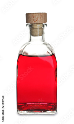 Glass bottle with wine vinegar on white background