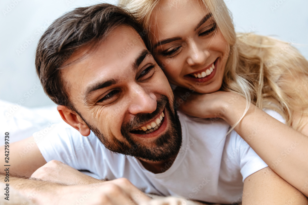 Love. Fun. Emotions. Young couple are hugging and laughing Love. Fun. Emotions. Young couple are hugging and laughing
