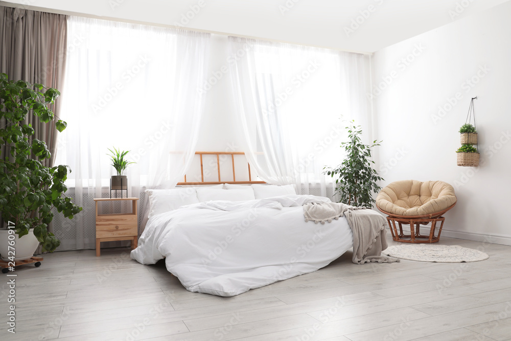 Obraz premium Light modern room interior with comfortable bed