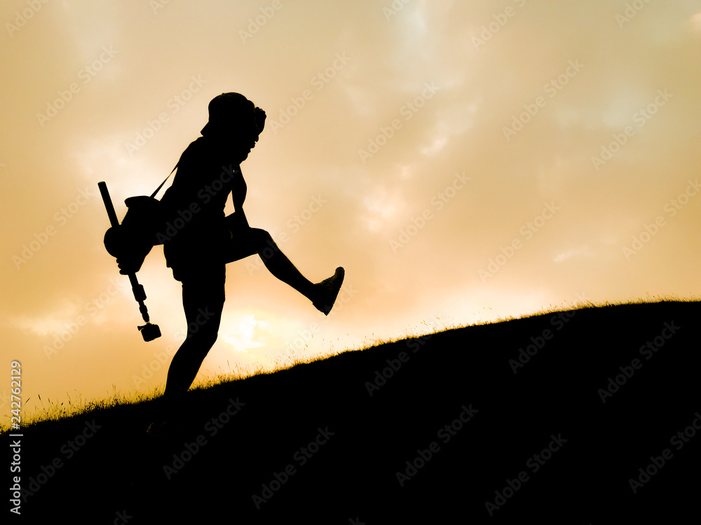 silhouette of tourist hiker acting on top of mountain silhouette of tourist hiker acting on top of mountain