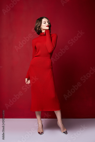 Принти на полотні Beautiful sexy pretty woman red lipstick jewelry earrings brunette hair cosmetic makeup fashion wear clothes style beauty salon happy party style Valentine's red background accessory brunette