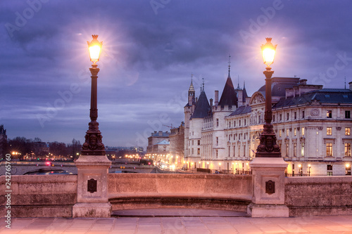 Night view of Paris from the bridge Pont Neuf on the Conciergerie