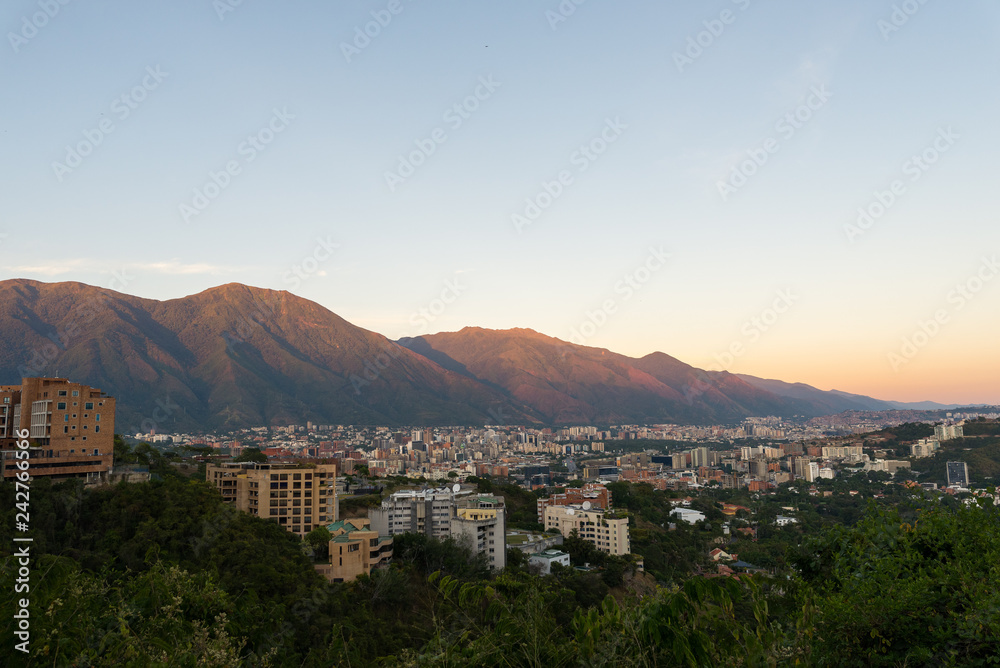 Skyline of Caracas city and Avila mountain, at sunset, in Venezuela