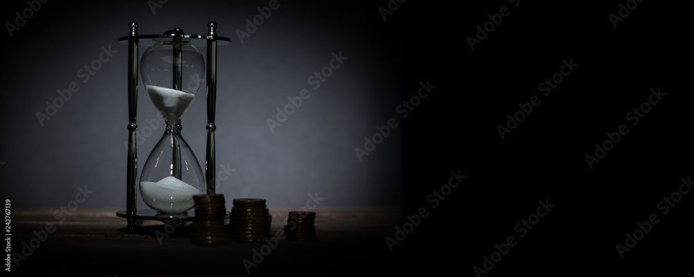 Time And Money Concept image - sand watch and coins