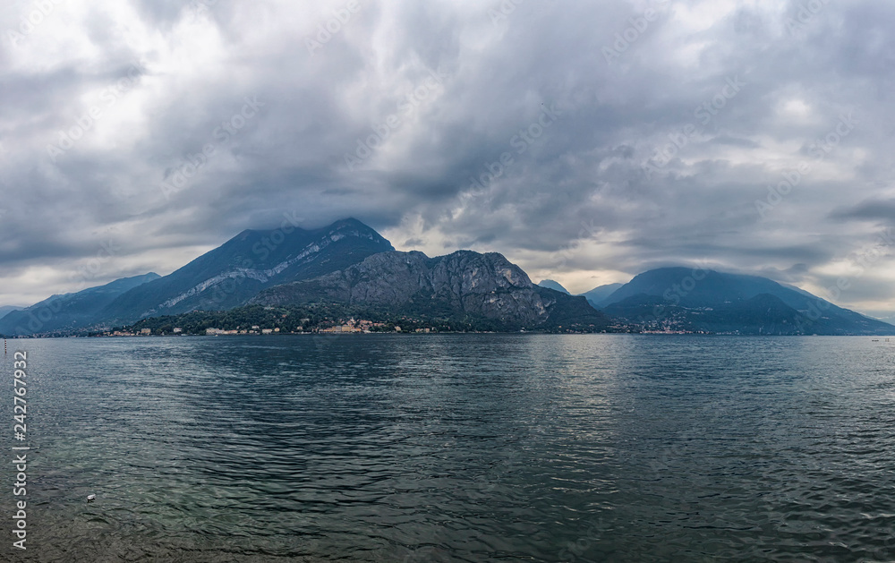 Beautiful panoramic view of Lake Como near Bellagio town, Lombardy province, Italy. Summer cloudy day. Dramatic sky