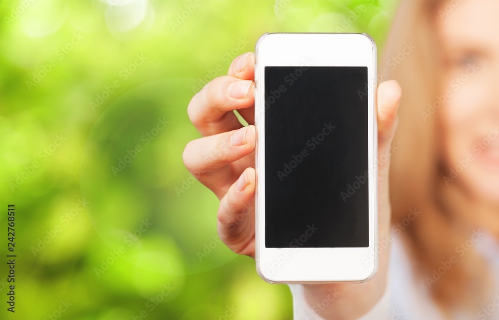 Female Hand holding smartphone