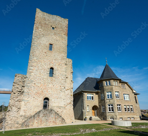 Castle of Useldange (Grand Duchy of Luxembourg) Inner courtyard with main tower (keep) and town hall photo