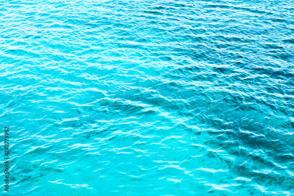 Background shot of aqua sea water surface ,bokeh (out of focus) Background shot of aqua sea water surface ,bokeh (out of focus)