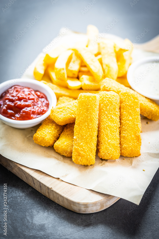 Fish finger and french fries or chips with tomato ketchup and mayonnaise  sauce Stock Photo