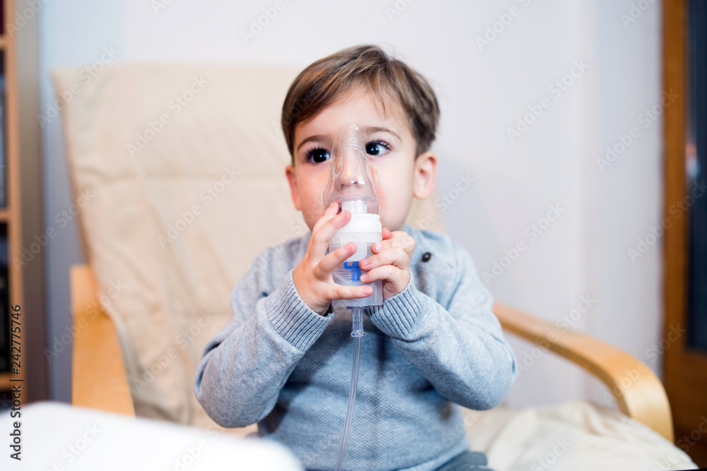 Little Boy using steam Inhalation machine at home Little Boy using steam Inhalation machine at home