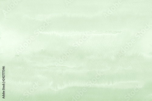 Green ink and watercolor textures on white paper background. Paint leaks and ombre effects. Hand painted abstract image.
