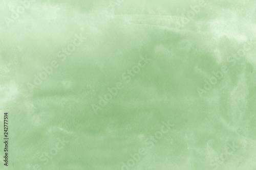 Green ink and watercolor textures on white paper background. Paint leaks and ombre effects. Hand painted abstract image.