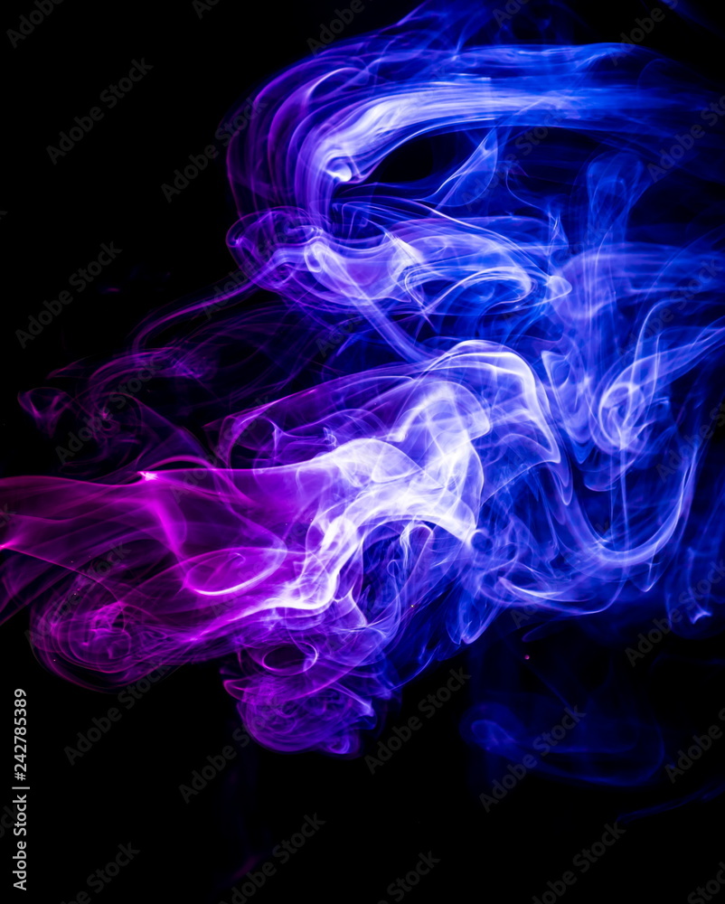 Obraz premium Colored smoke on black background
