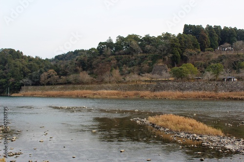 Kuma River flows by a historic castle site in Japan