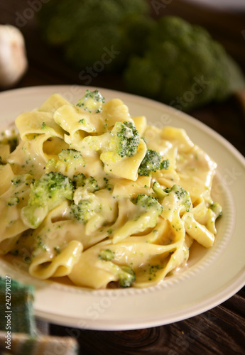 Tagiatelle pasta with cheese sauce and broccoli