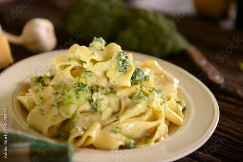 Tagliatelle pasta with cheese sauce and broccoli