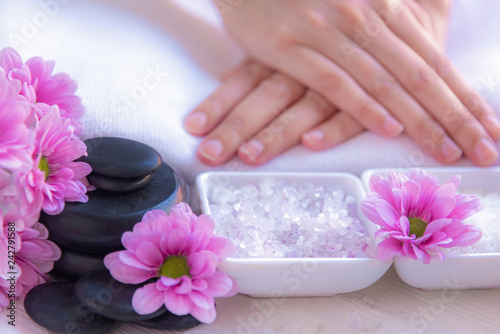 Spa treatment and product for female feet and manicure nails spa with rock and pink flower, copy space, select focus, Thailand