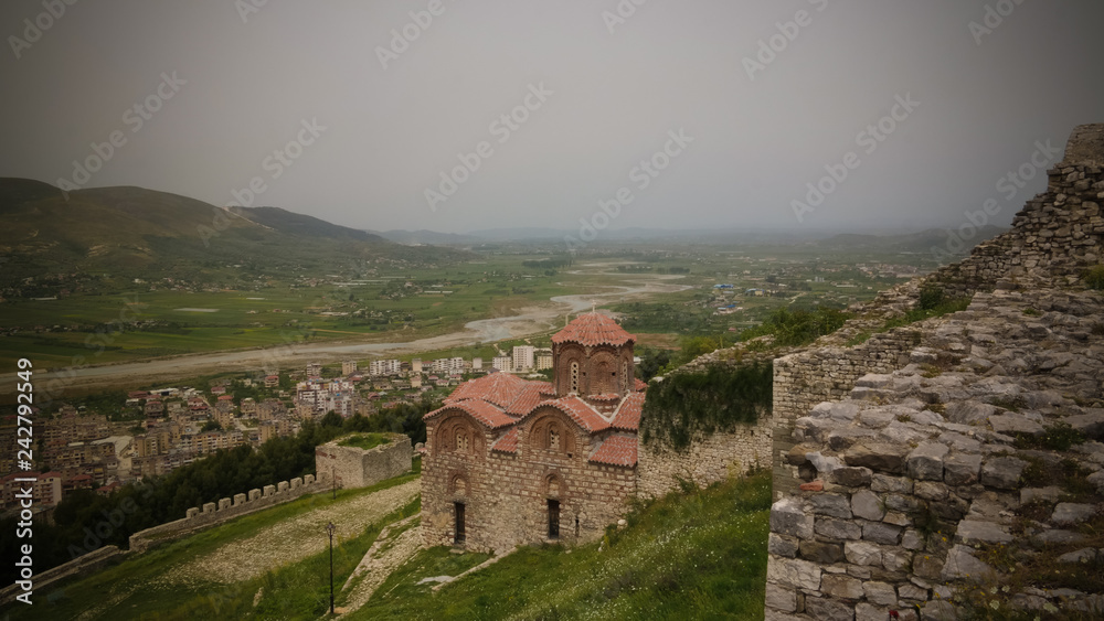 Panoramic aerial view to Berat old town and Osum river and Holy Trinity Church from Berat Castle , Albania Panoramic aerial view to Berat old town and Osum river and Holy Trinity Church from Berat Castle , Albania