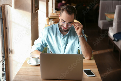 Young businessman working o...