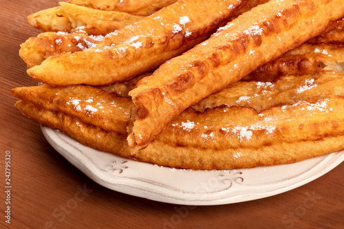 A closeup of traditional Spanish porras, a typical Madrid Sunday breakfast