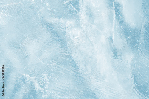 Ice background. Pattern of transparent shiny ice. Natural bright background