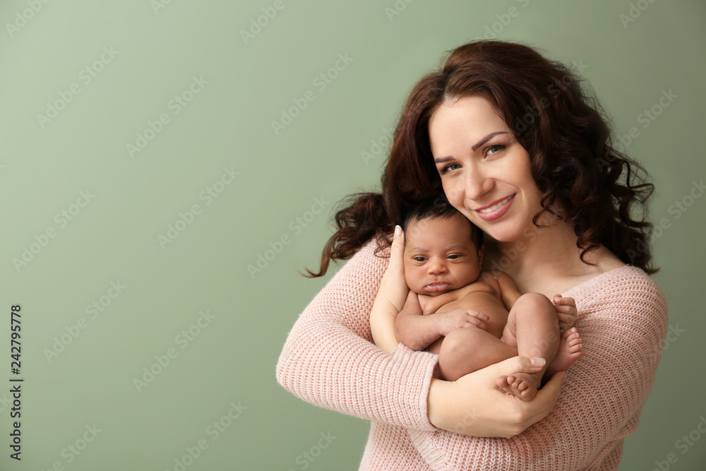 Portrait of happy mother with little baby on color background Portrait of happy mother with little baby on color background