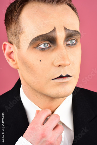 Being completely at a loss. Stage actor playing. Theatre actor miming. Mime with face paint. Mime artist. Man with mime makeup. Drama or tragedian performer. Theatrical performance art and pantomime