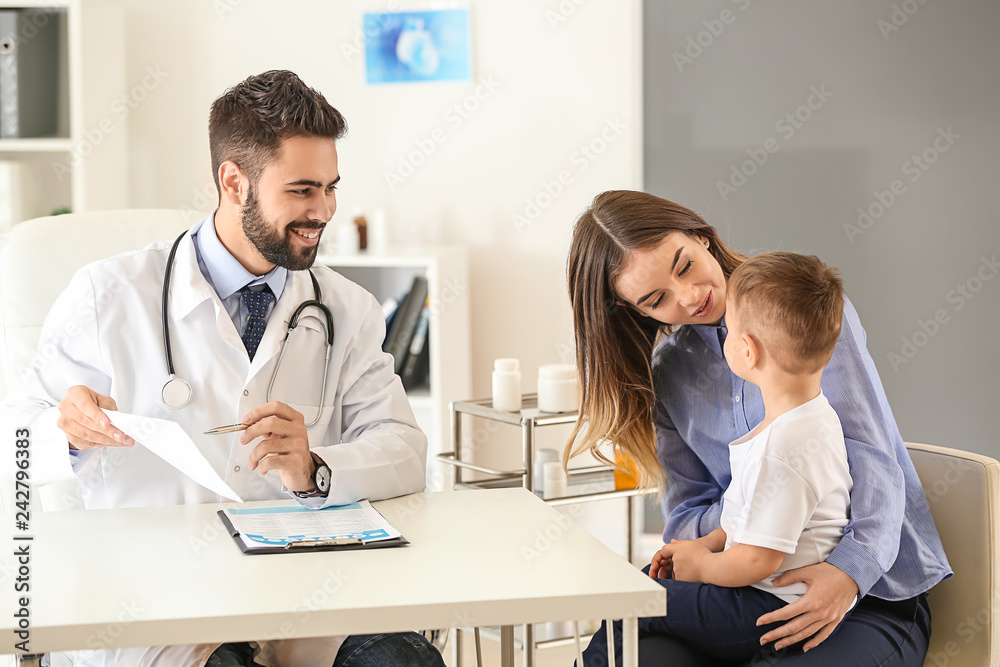 Young mother with her little son visiting doctor in clinic