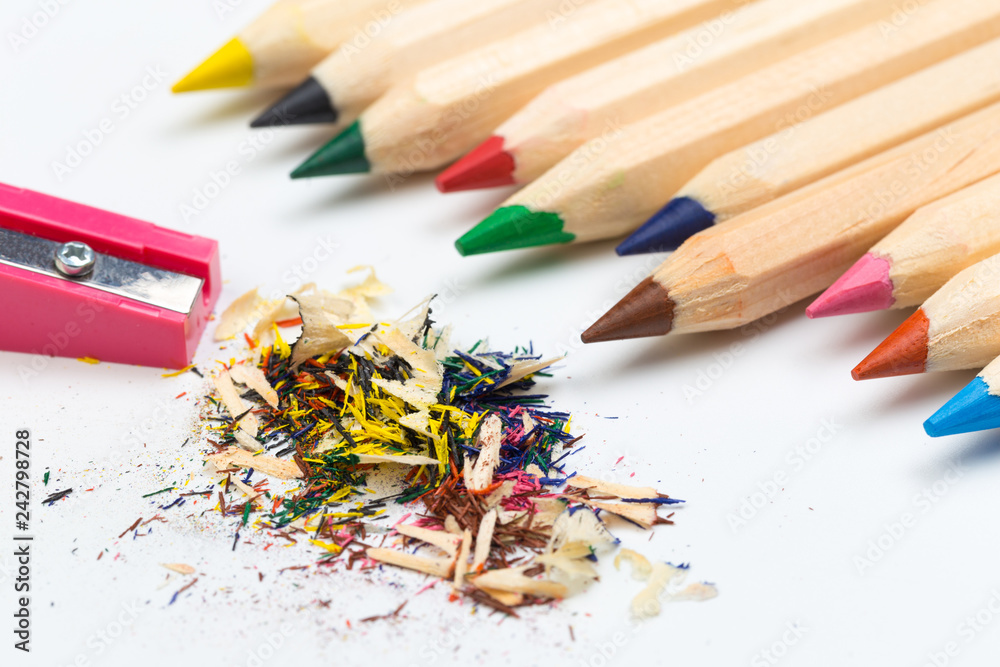 Wooden colorful pencils isolated on a white background, pencil sharpeners. Wooden colorful pencils isolated on a white background, pencil sharpeners.