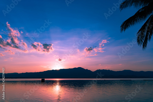 Beach with island sun light and blue sky background.