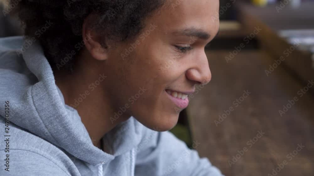 Man using mobile phone in cafe Man using mobile phone in cafe