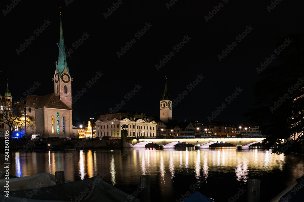 Zurich, ZH / Switzerland - January 4, 2019: night time city skyline view of Zurich with the river Limmat