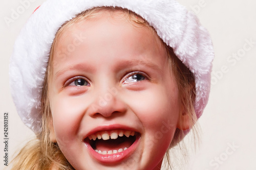 Portrait of little girl crying. Isolated on white background.