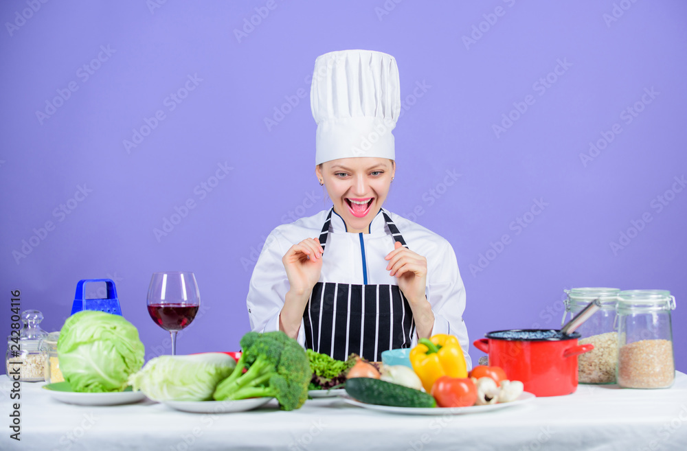 Girl in hat and apron. Cooking healthy food. Fresh vegetables ingredients for cooking meal. Lets start cooking. Woman chef cooking healthy food. Gourmet main dish recipes. Delicious recipe concept Girl in hat and apron. Cooking healthy food. Fresh vegetables ingredients for cooking meal. Lets start cooking. Woman chef cooking healthy food. Gourmet main dish recipes. Delicious recipe concept