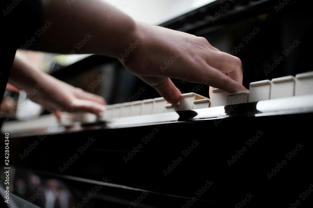 Beautiful asian girl learn to play piano.