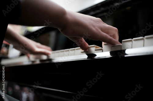 Beautiful asian girl learn to play piano.