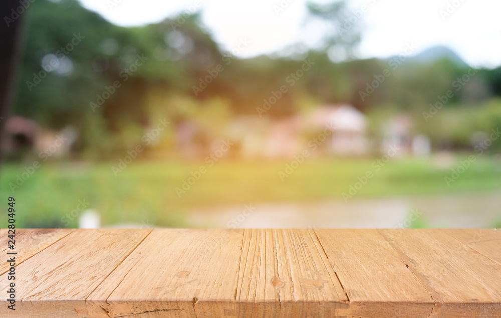 Empty dark wooden table in front of abstract blurred bokeh background of restaurant . can be used for display or montage your products.Mock up for space. Empty dark wooden table in front of abstract blurred bokeh background of restaurant . can be used for display or montage your products.Mock up for space.