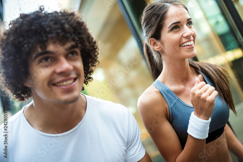 Couple jogging and running outdoors in city