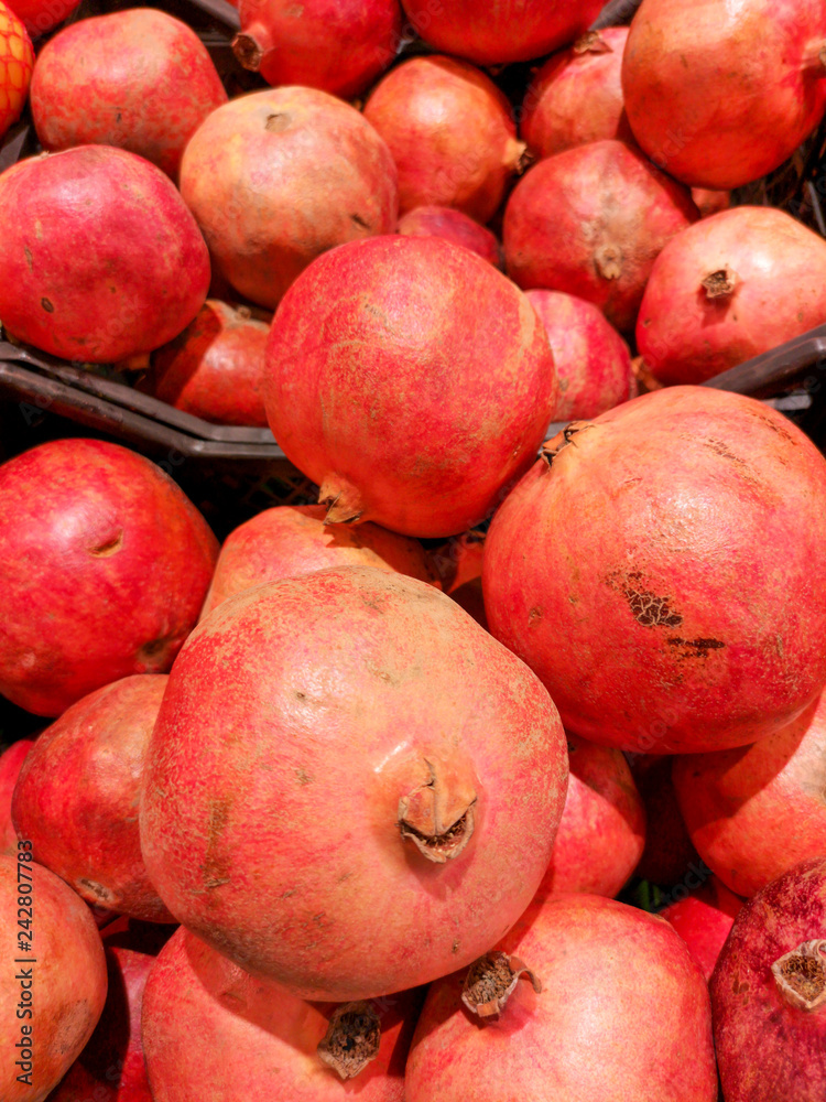Ripe pomegranates on a shop window Ripe pomegranates on a shop window
