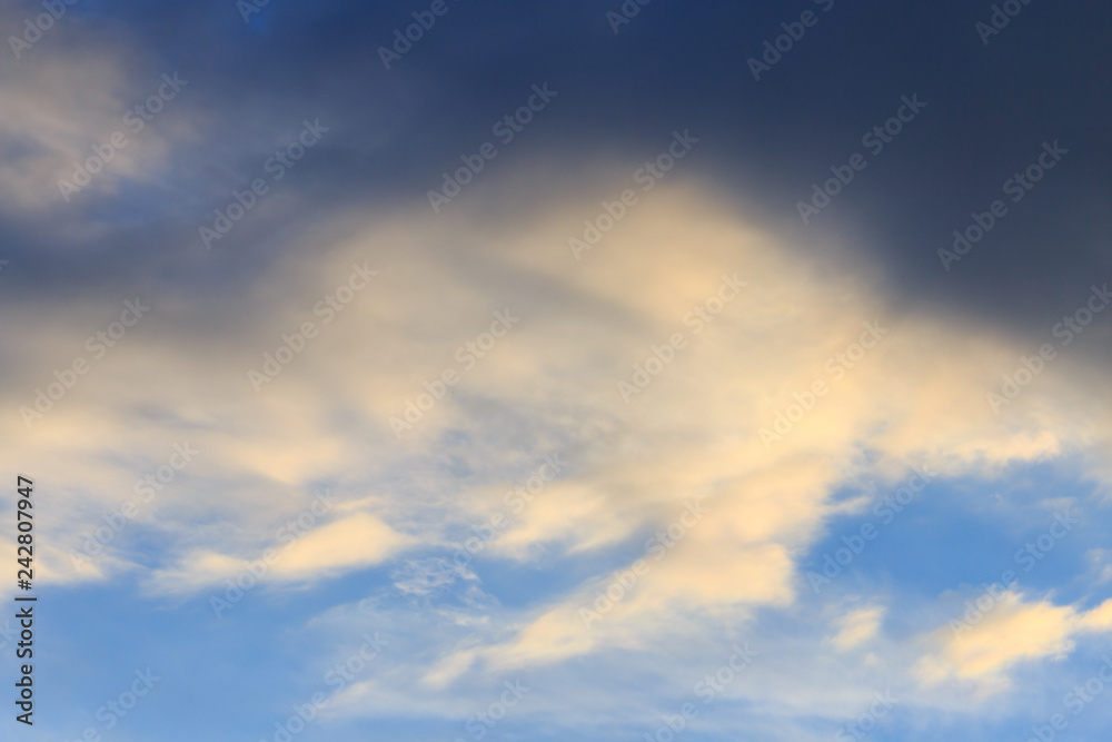 Clouds after rain before sunset as a background