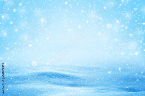 Natural sunny snow drifts background with shades and falling snow flakes. © fotoyou